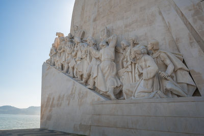 Low angle view of statue against sky