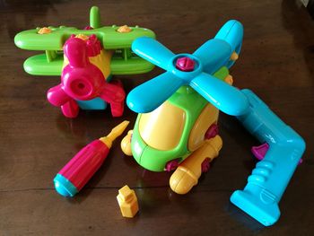 High angle view of plastic toys on wooden table