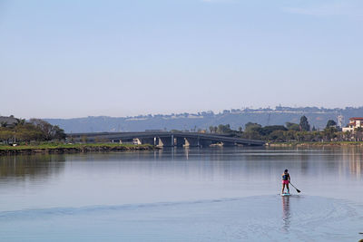 Solitude and serenity. paddle boarder on the calm lagoon. lifestyle, san diego, california. 