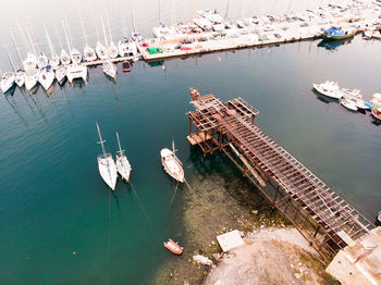 High angle view of boats moored at harbor