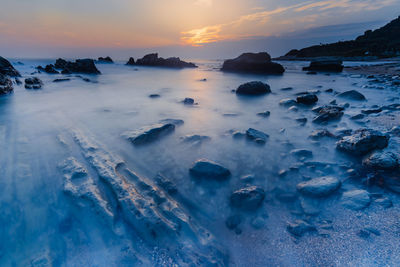 Scenic view of sea against sky during sunset