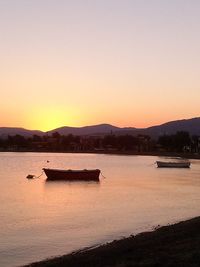 Scenic view of calm sea at sunset