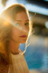 Portrait of young woman in sunny day