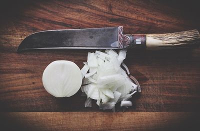 High angle view of chopped onion on cutting board