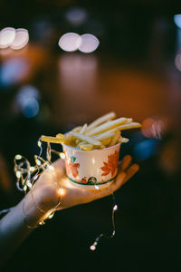 Close-up of hand holding ice cream