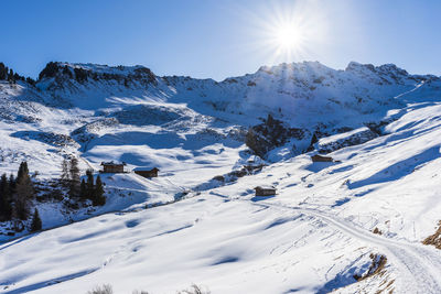 Views and huts in the snow. alpe di siusi. italy