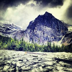 Scenic view of mountains against cloudy sky