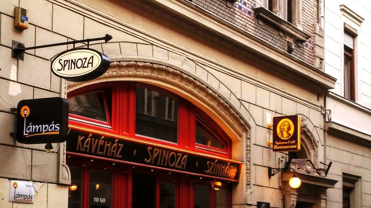 LOW ANGLE VIEW OF ROAD SIGN ON BUILDING