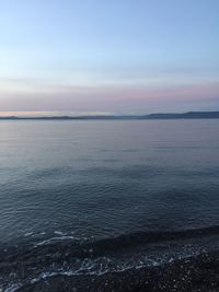 Scenic view of sea against sky at sunset