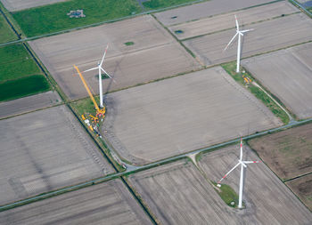 High angle view of wind turbines on field