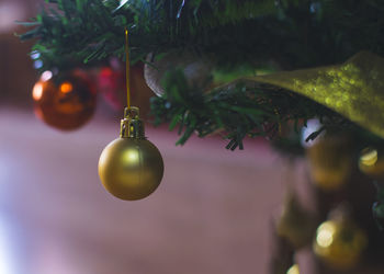 Baubles, lights and other decoration on christmas's tree.