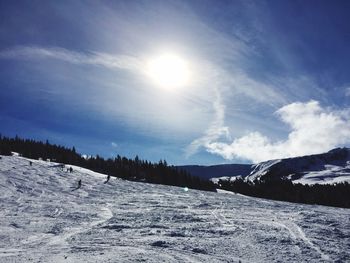 Scenic view of snow covered mountain against sky
