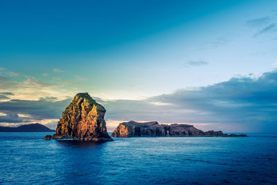 Scenic view of sea against blue sky