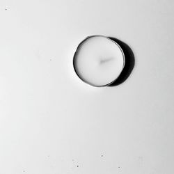 Close-up of white object over white background