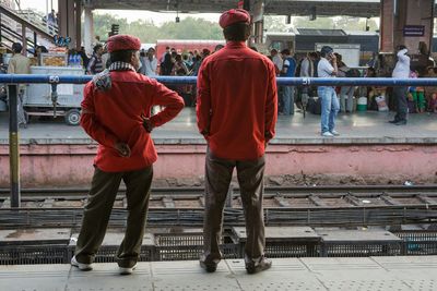 Full length of porters at railway station