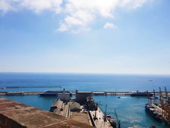 High angle view of harbor by sea against sky