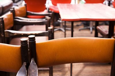 Close-up of chairs on table in restaurant