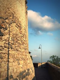 Close-up of street light against wall