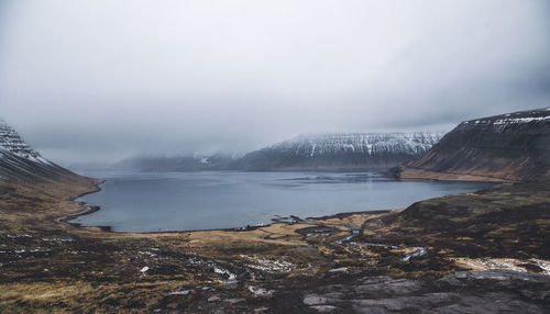 Scenic view of mountains against sky during winter