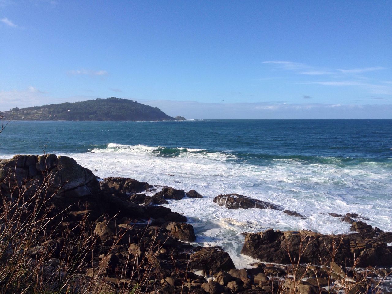 sea, water, horizon over water, scenics, tranquil scene, beauty in nature, beach, tranquility, sky, shore, wave, rock - object, blue, nature, surf, idyllic, coastline, rock formation, outdoors, seascape