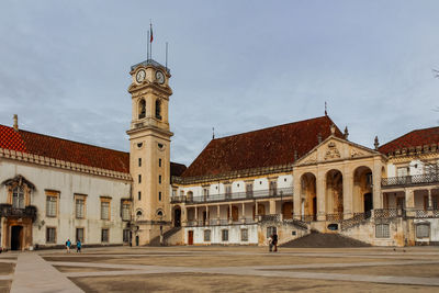 View of historic coimbra university building against sky 
