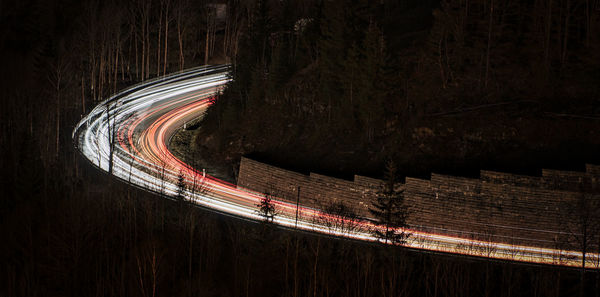 High angle view of light trails on road