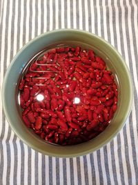 High angle view of strawberries in bowl on table