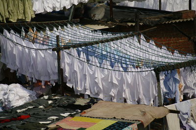 Clothes drying on roof at market