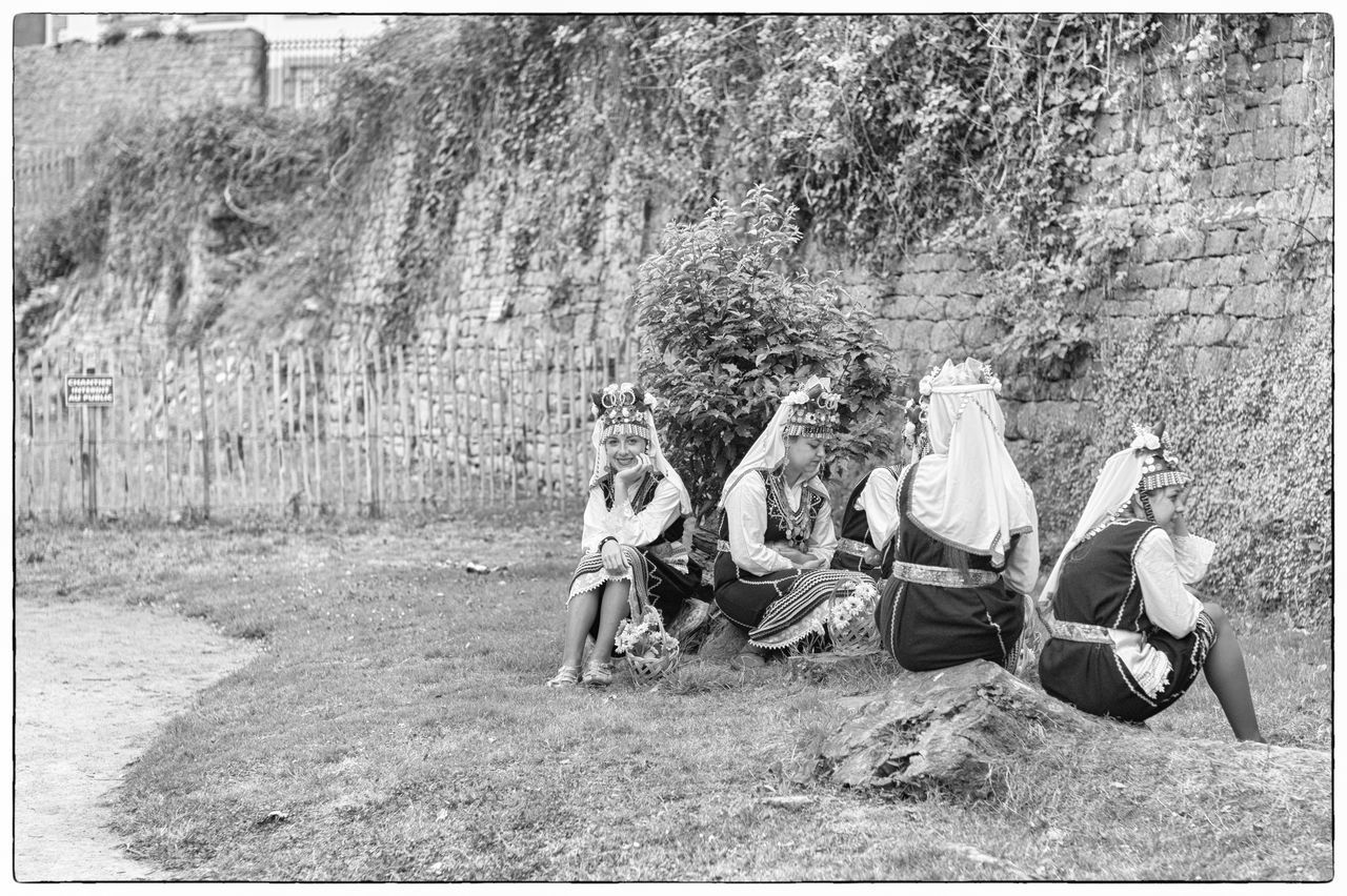 group of people, plant, day, sitting, tree, transfer print, real people, auto post production filter, men, leisure activity, land, full length, lifestyles, casual clothing, nature, people, growth, togetherness, grass, outdoors