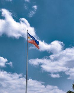 Low angle view of flag against sky