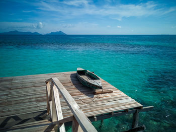 Wooden pier turquoise sea water sunny day, bum bum island, semporna.