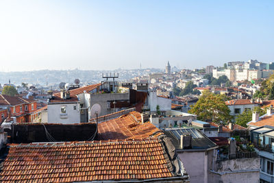 Rooftops of istanbul with galata tower on a sunny fall day