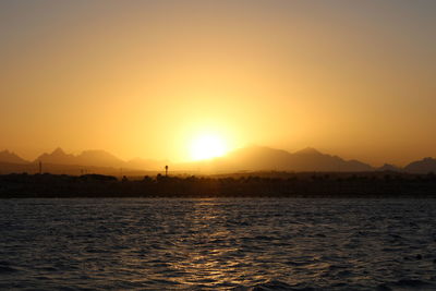 Scenic view of sea against sky during sunset