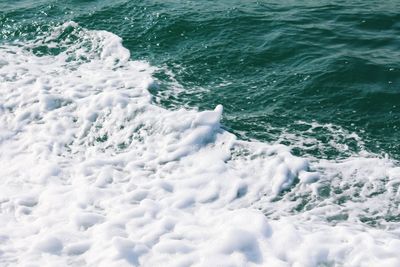 High angle view of surf at sea shore