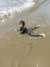 High angle view of man in sea at beach