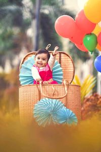 Portrait of happy girl holding umbrella