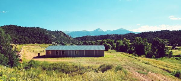 Built structure on field against sky