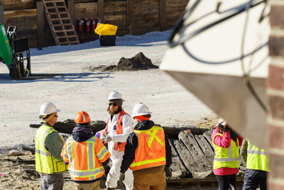 Rear view of construction workers