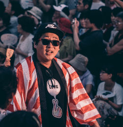 Portrait of young man wearing sunglasses standing outdoors