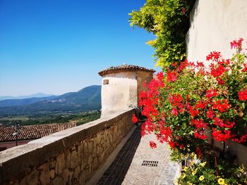 Built structure by wall against clear sky