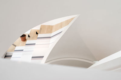 Low angle view of book against white background