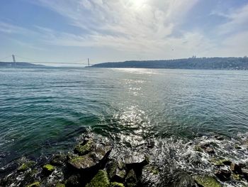 Scenic view of bay against sky