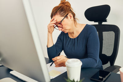 Young woman using laptop at home