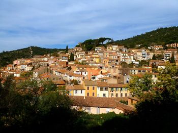 High angle view of town against cloudy sky