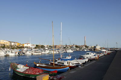 Boats moored at harbor