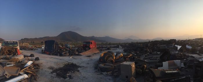 Panoramic view of old buildings in city against sky during sunset