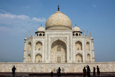 Group of people in front of historical building