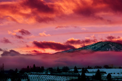 Scenic view of mountains against cloudy sky