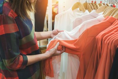 Midsection of woman standing in store