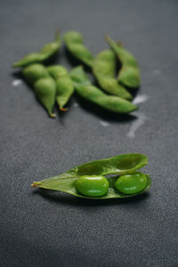 Close-up of green chili pepper on table